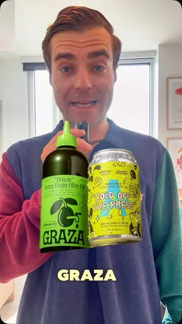 Jonathan with Graza olive oil and an olive oil beer can